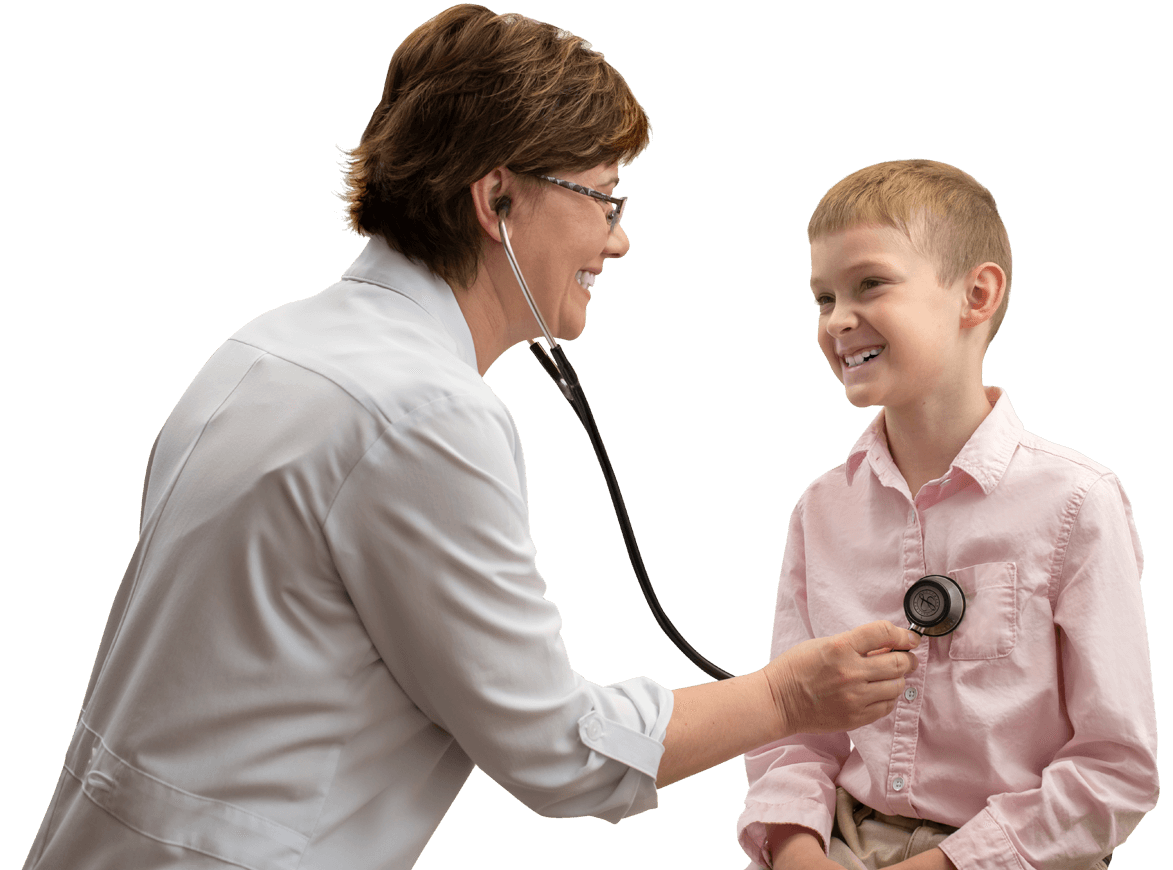 a doctor examines a boy at an appointment
